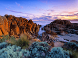 Rock formations surrounding a narrow inlet in outdoor natural landscape